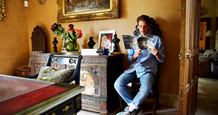 Teenager reading magazine Sudeley